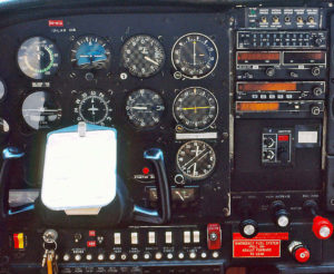 C-185 panel showing a six-pack in front and King Silver Crown radios.