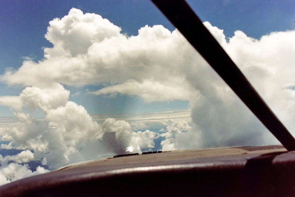 Flying through clouds over the "baranco" (cliff) while returning to Shell from the jungle.