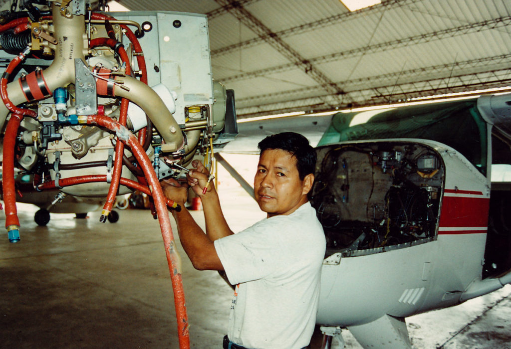 Mateo, a Lowland Quichua, prepares to install a new engine in a C-206.
