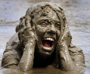 man trapped in mud crying for working grace
